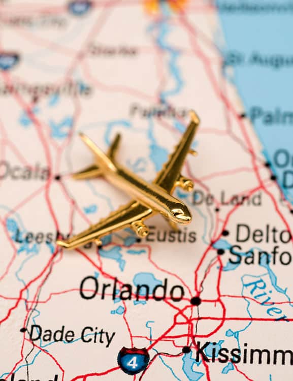 Airplane flying over a map of Orlando Florida