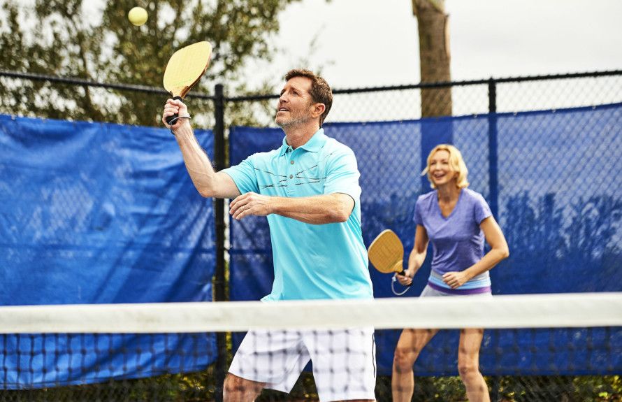 Seniors playing tennis